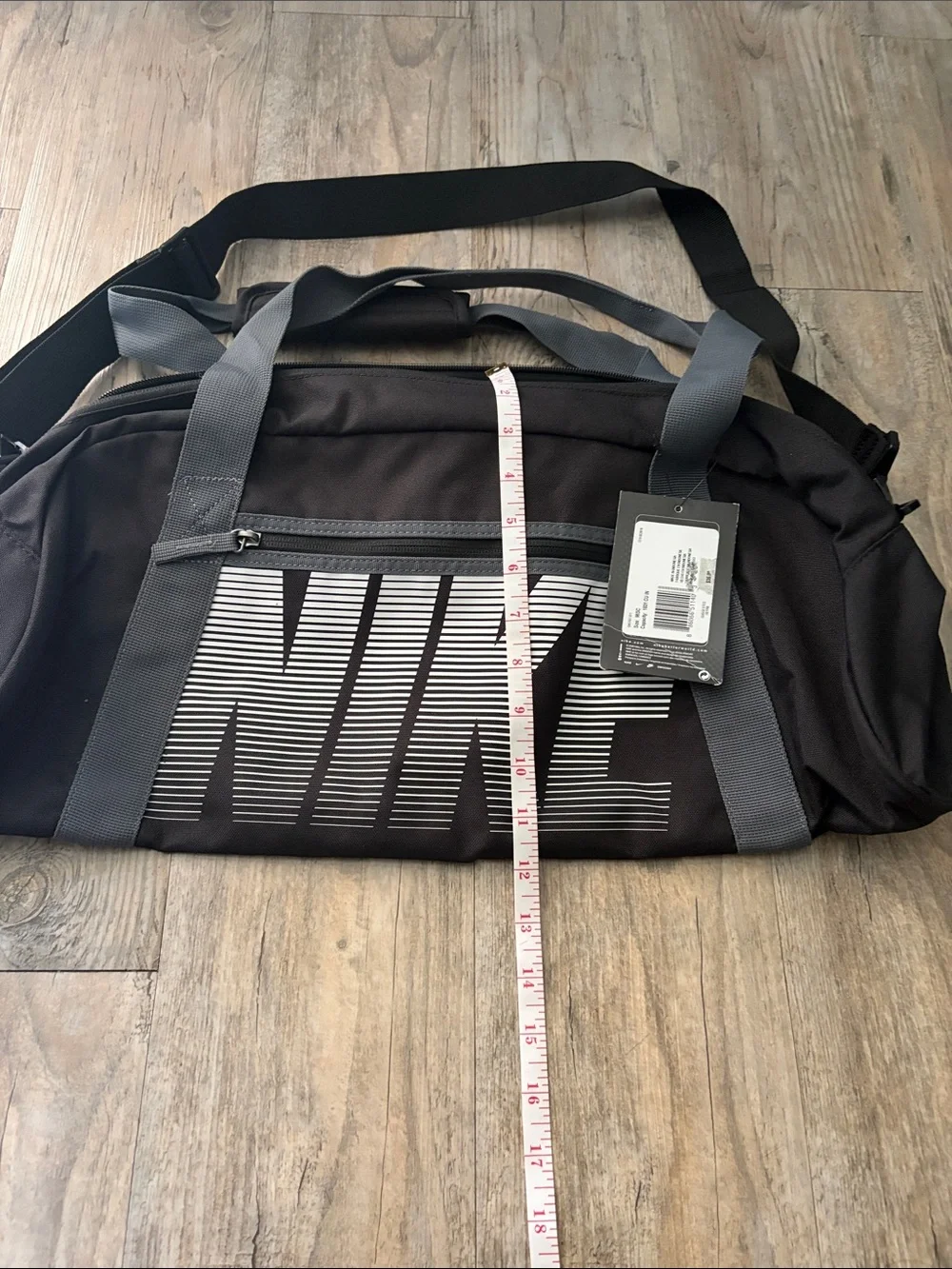 Nike Black Duffel Bag with Gray Straps and White Logo